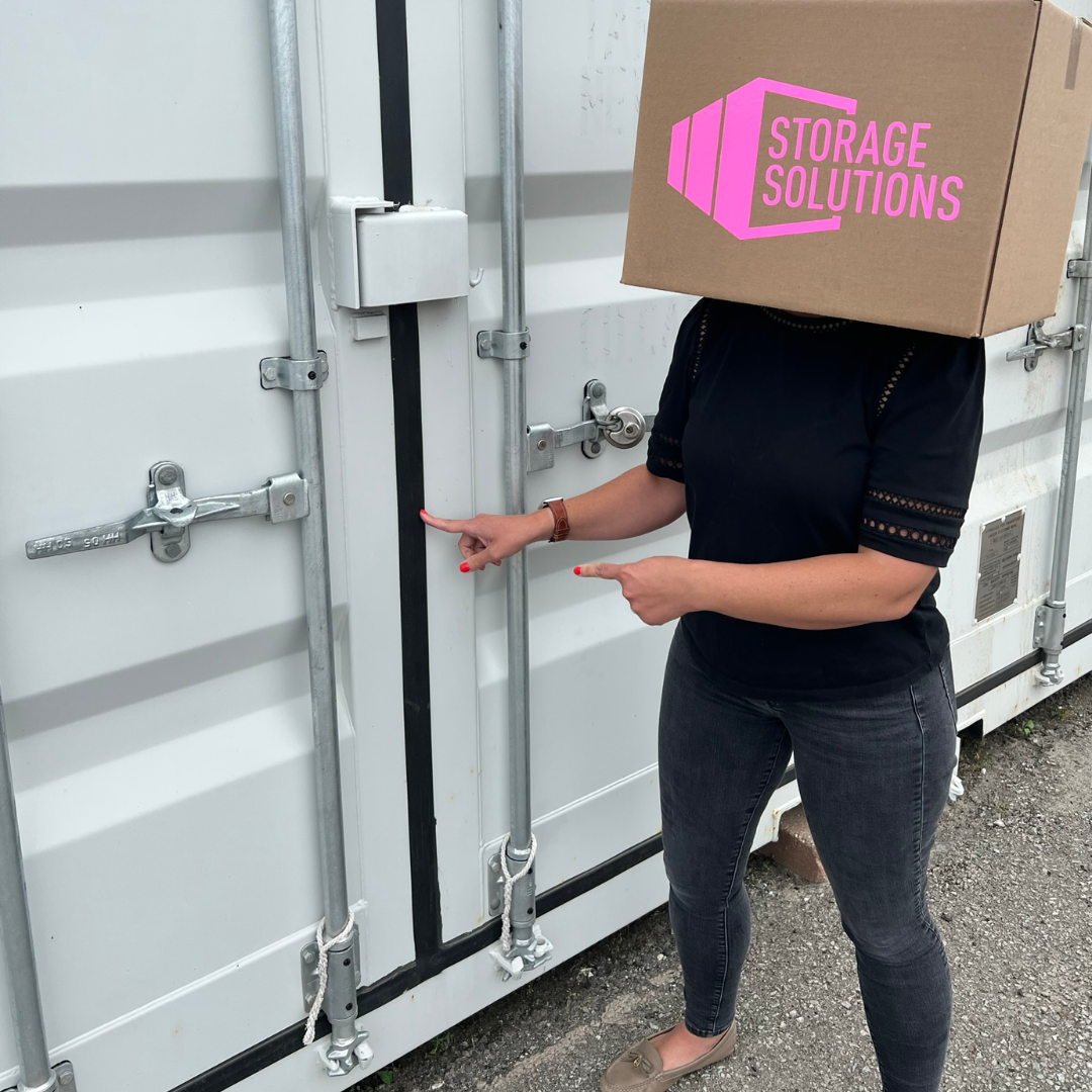 a photo of a person pointing to the rubber seal on storage container doors